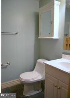 11607 Stoneview Square, Unit 2B Reston, VA 20191 - Photo 14 of 20 a white toilet sitting next to a bathroom sink