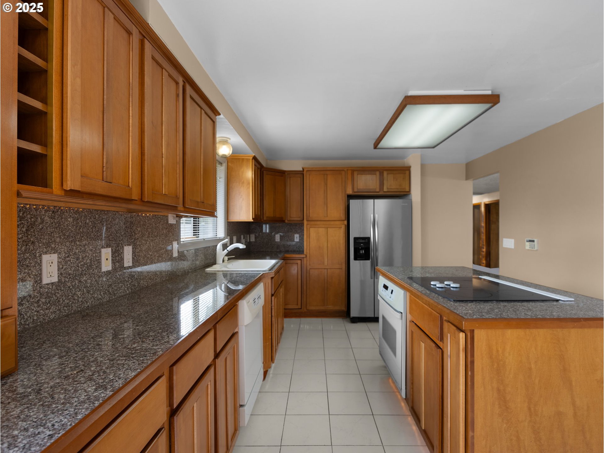 462 Northeast 24th Street Gresham, OR 97030 - Photo 12 of 37 a kitchen with stainless steel appliances granite countertop a sink stove and refrigerator