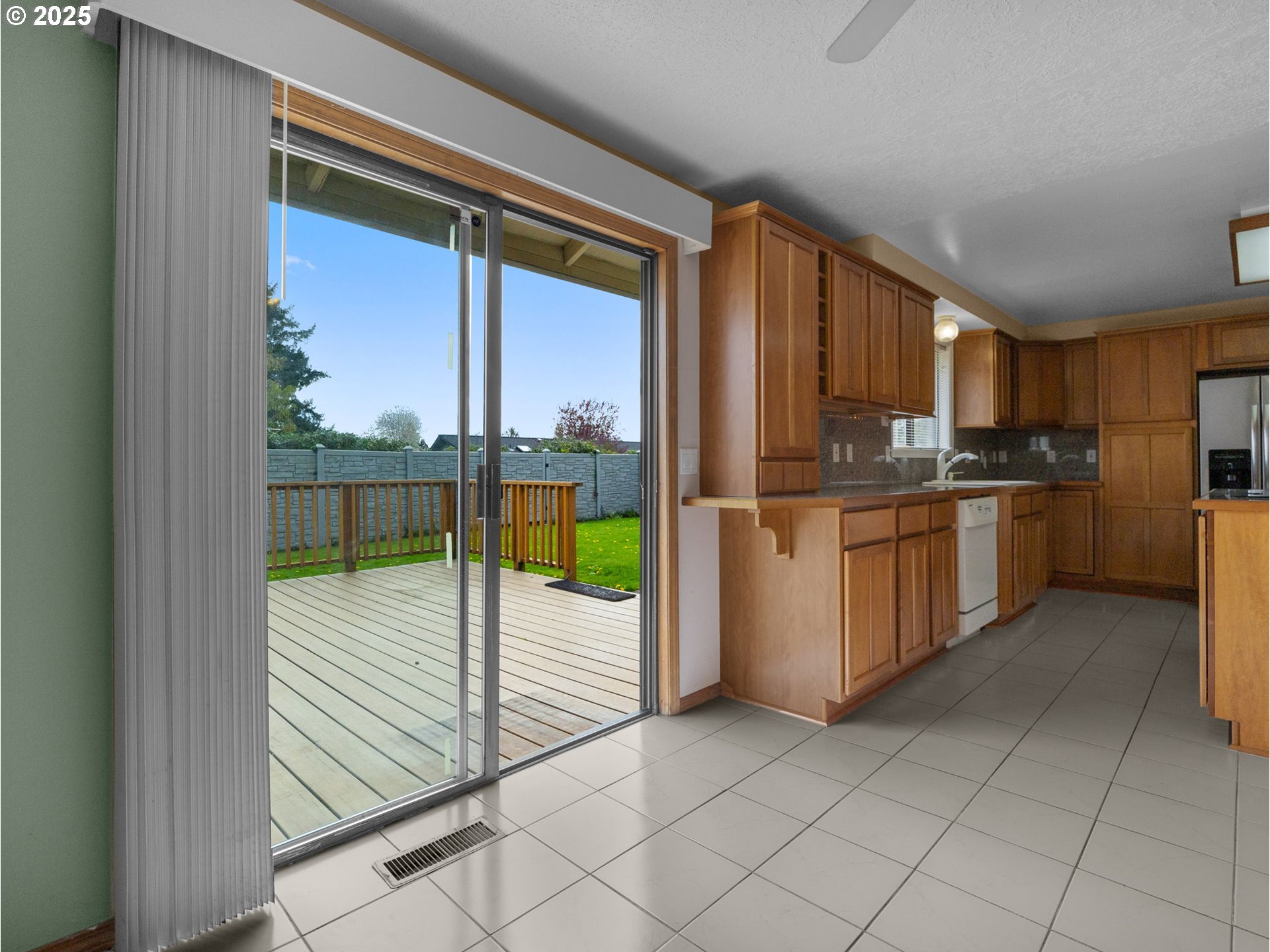 462 Northeast 24th Street Gresham, OR 97030 - Photo 13 of 37 a kitchen with stainless steel appliances granite countertop a refrigerator and a sink