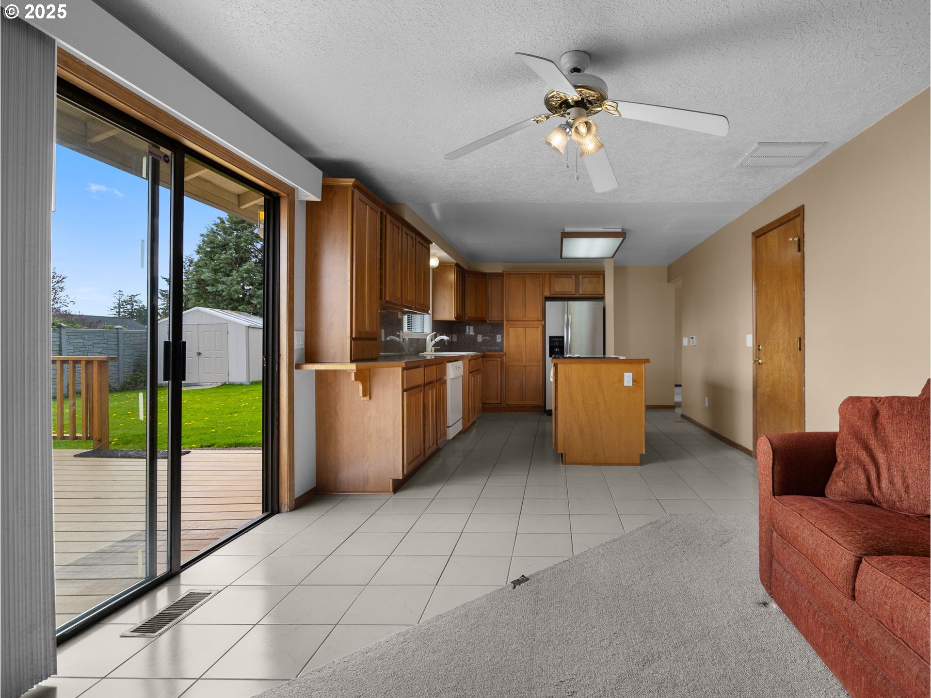 462 Northeast 24th Street Gresham, OR 97030 - Photo 14 of 37 a living room with furniture and a chandelier