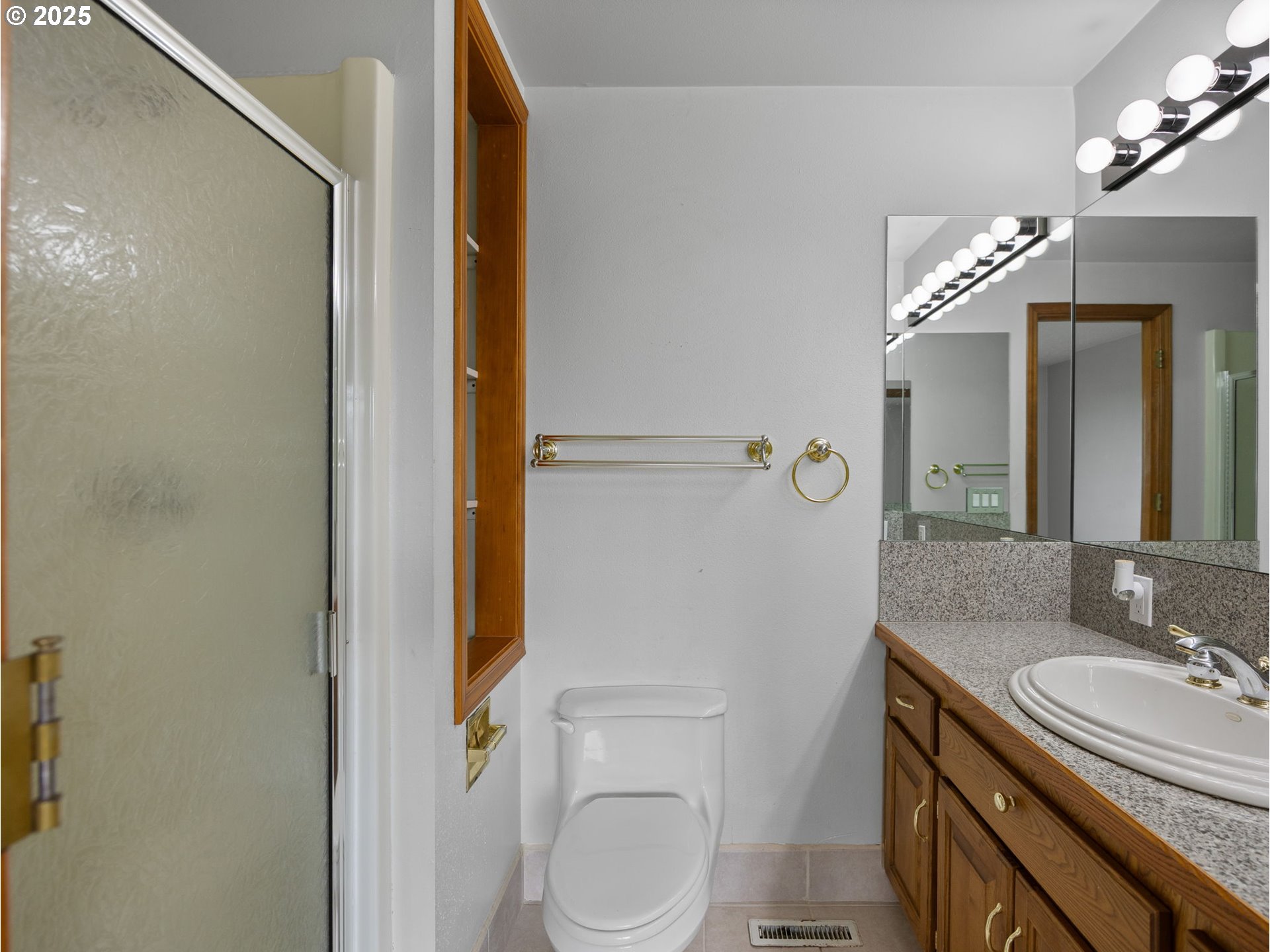 462 Northeast 24th Street Gresham, OR 97030 - Photo 19 of 37 a bathroom with a granite countertop sink toilet and shower