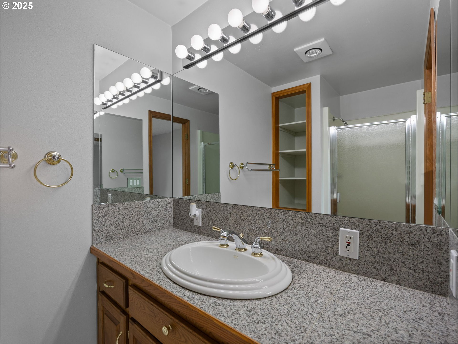 462 Northeast 24th Street Gresham, OR 97030 - Photo 20 of 37 a bathroom with a granite countertop sink a light fixture and a mirror