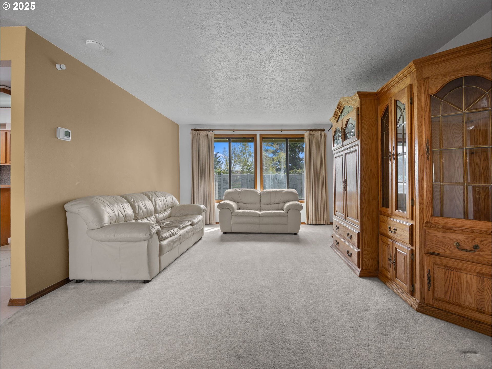 462 Northeast 24th Street Gresham, OR 97030 - Photo 9 of 37 a living room with furniture and a large window