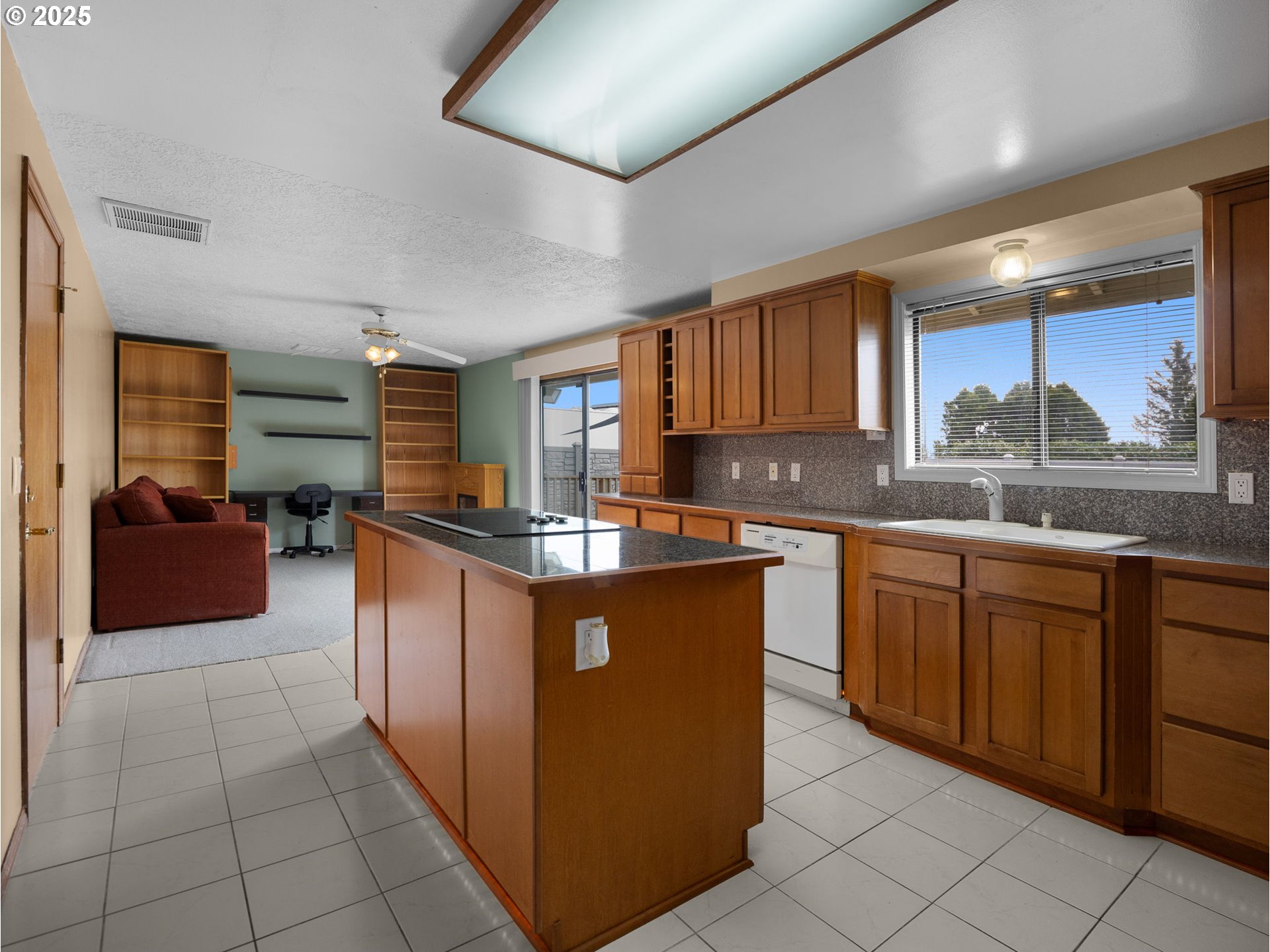 462 Northeast 24th Street Gresham, OR 97030 - Photo 10 of 37 a kitchen with stainless steel appliances granite countertop a sink counter space cabinets and a large window