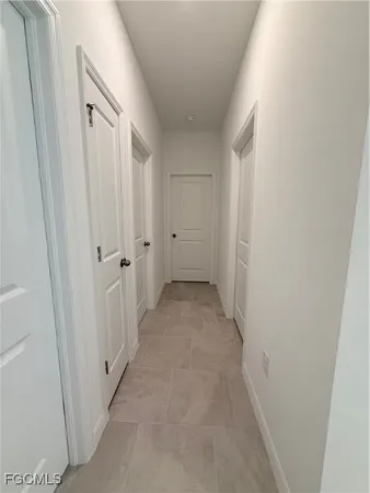 a view of a hallway with white walls