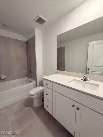 a bathroom with a toilet a sink and bathtub