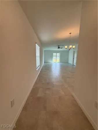 a view of hallway with livingroom