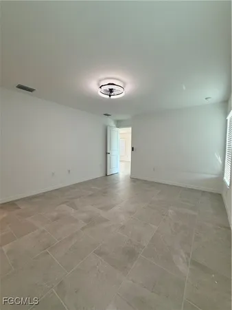 a bathroom with double sink and a mirror