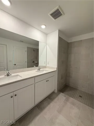 a white toilet sitting next to a white wall