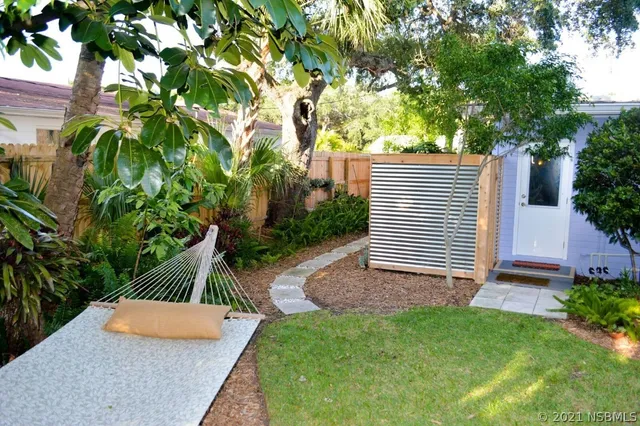 a backyard of a house with lots of green space