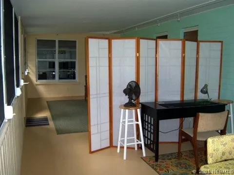 a view of a dining room with furniture window and outside view