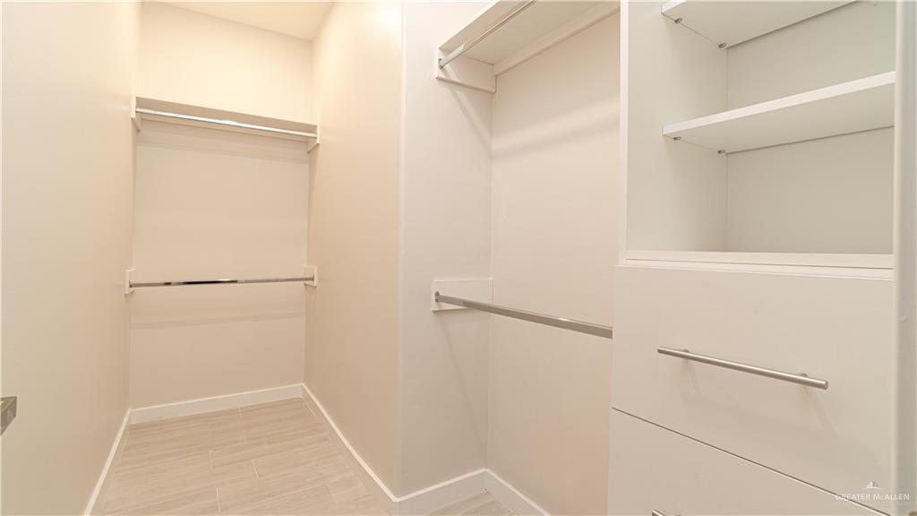 11500 North 25th Lane, Unit 2 McAllen, TX 78504 - Photo 14 of 19 a view of walk in closet with empty racks