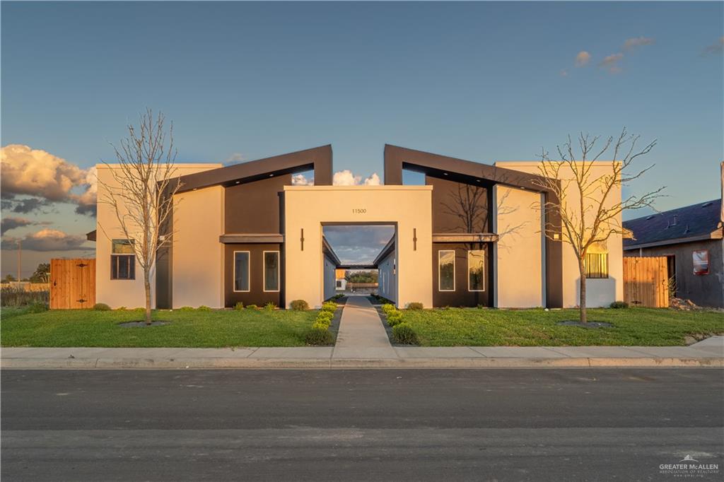 11500 North 25th Lane, Unit 2 McAllen, TX 78504 - Photo 2 of 19 a front view of a house with a garden and pathway