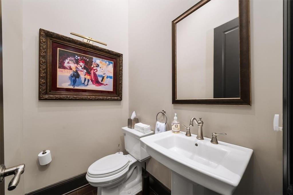 2916 Hermance Drive Northeast Atlanta, GA 30319 - Photo 14 of 38 a bathroom with a toilet a sink and mirror