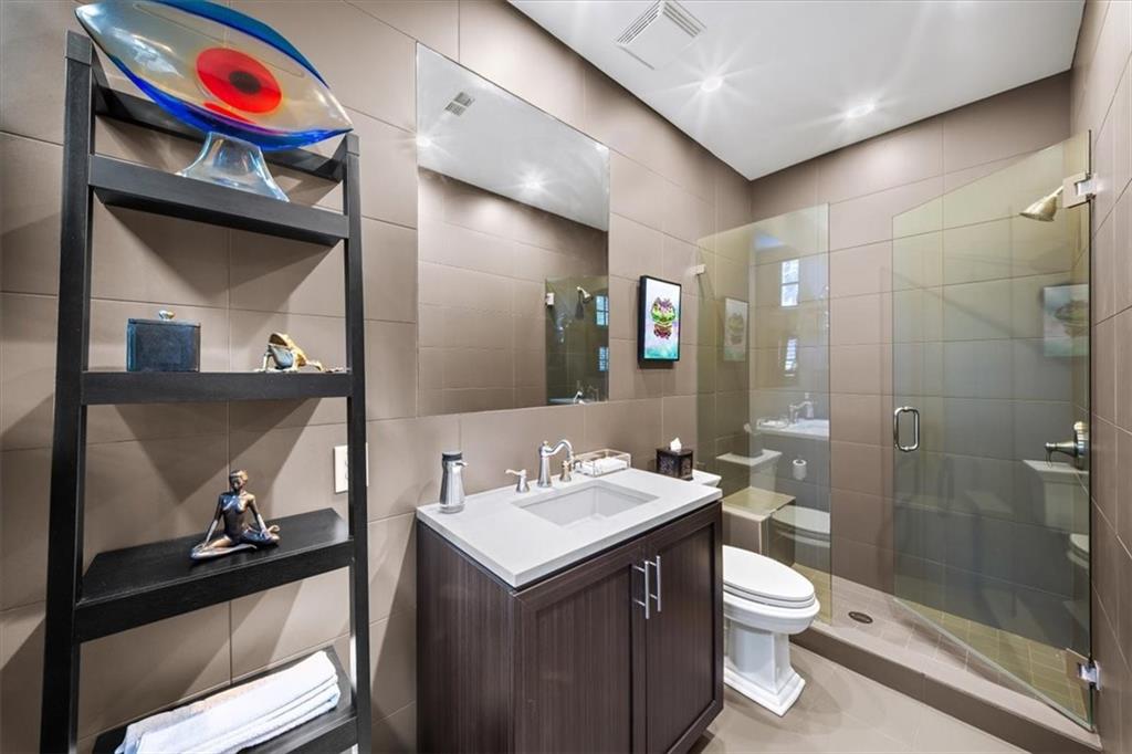 2916 Hermance Drive Northeast Atlanta, GA 30319 - Photo 28 of 38 a bathroom with a sink a toilet and shower