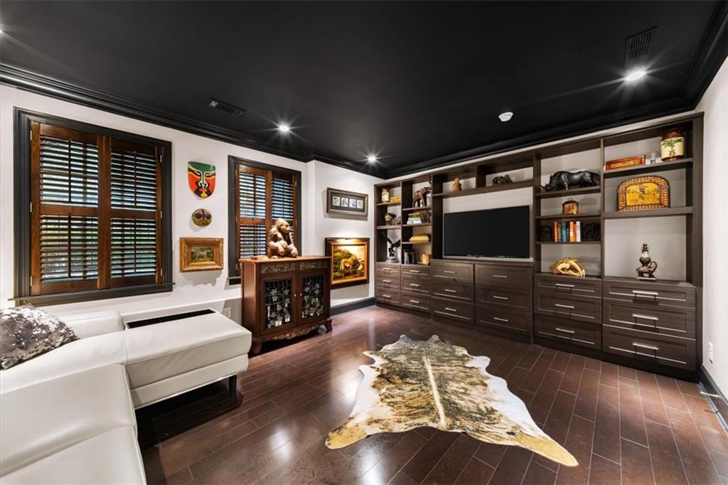 2916 Hermance Drive Northeast Atlanta, GA 30319 - Photo 30 of 38 a living room with furniture and a flat screen tv