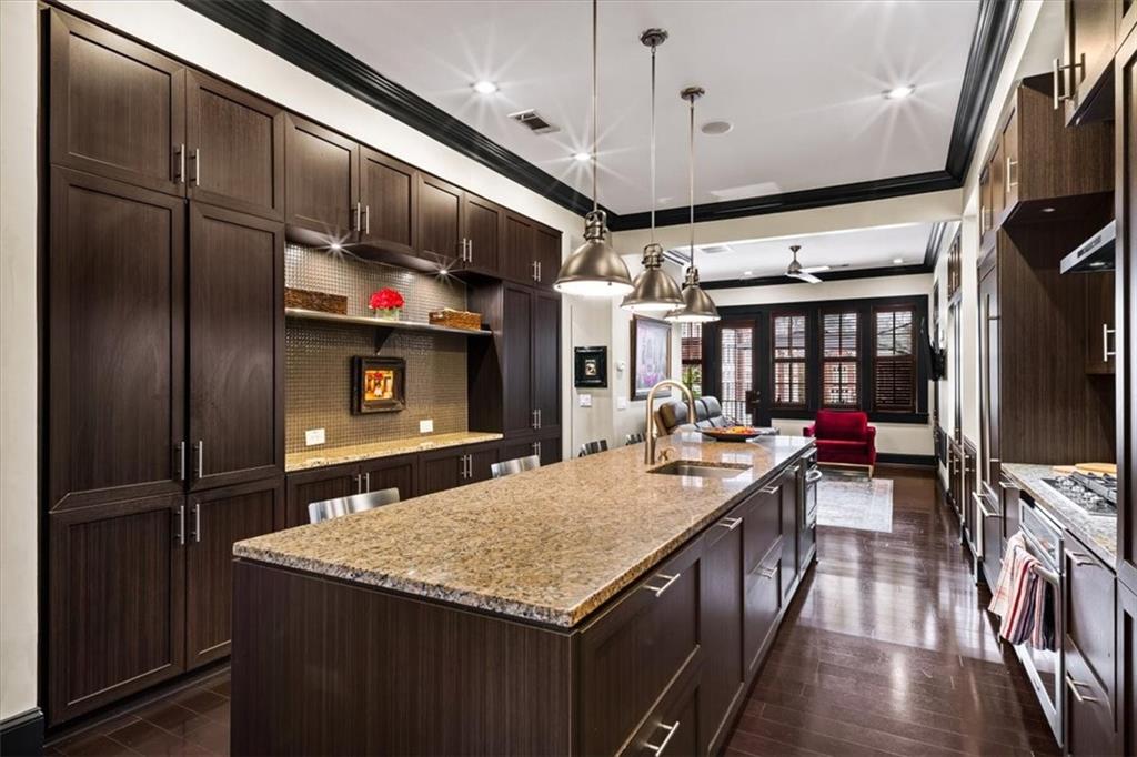2916 Hermance Drive Northeast Atlanta, GA 30319 - Photo 6 of 38 a kitchen with a stove a refrigerator and a flat screen tv