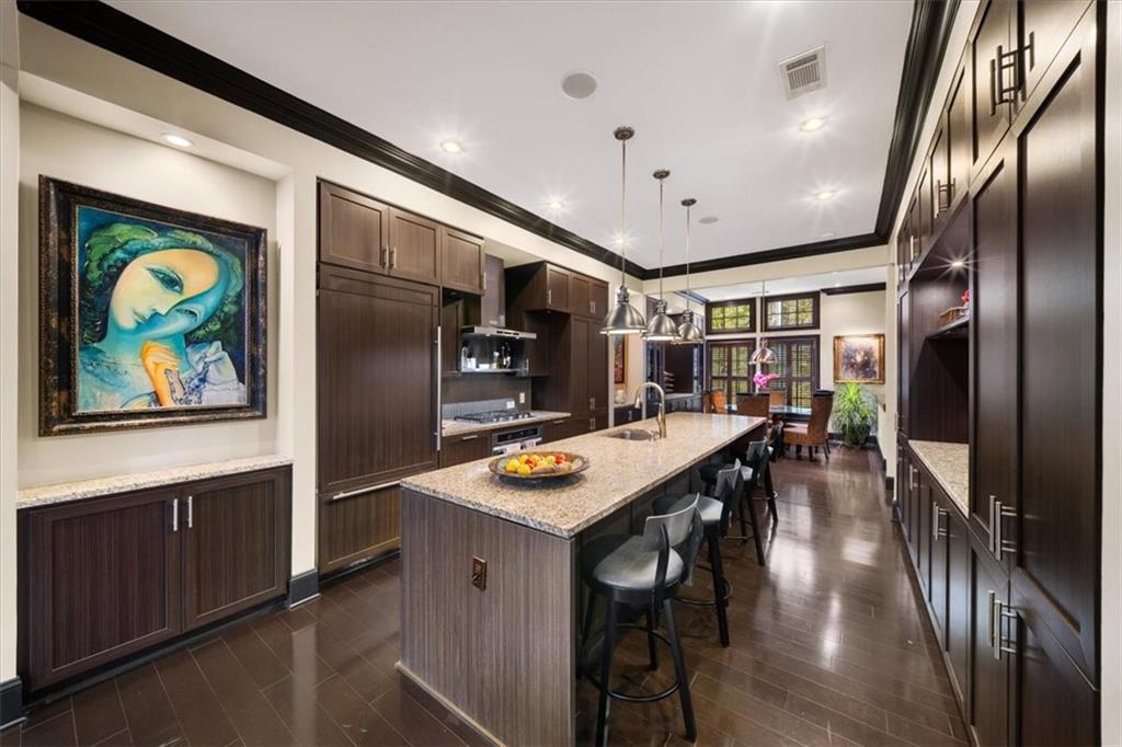 2916 Hermance Drive Northeast Atlanta, GA 30319 - Photo 8 of 38 a kitchen with stainless steel appliances granite countertop a refrigerator a stove and a sink with wooden floor