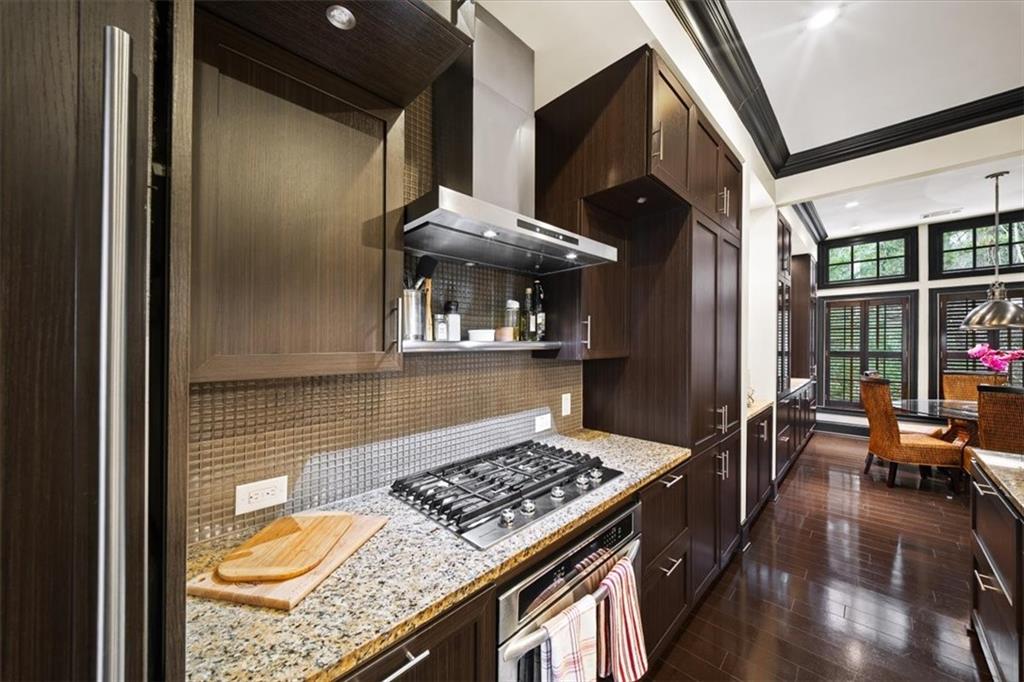2916 Hermance Drive Northeast Atlanta, GA 30319 - Photo 10 of 38 a kitchen with stainless steel appliances granite countertop a stove and a wooden cabinets