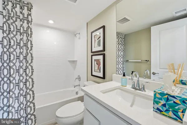 a bathroom with a sink a toilet and a bathtub