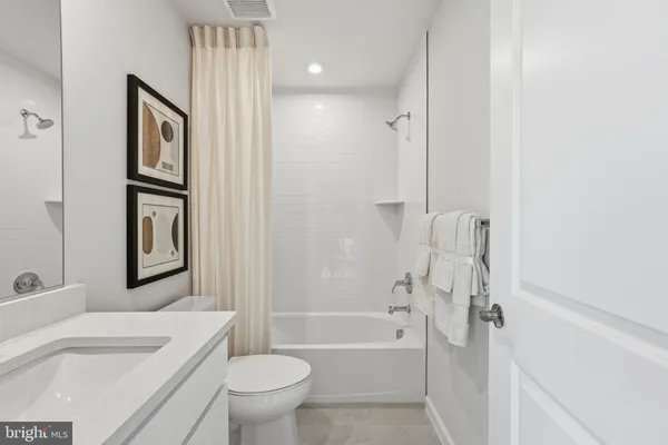 a bathroom with a toilet sink and bathtub