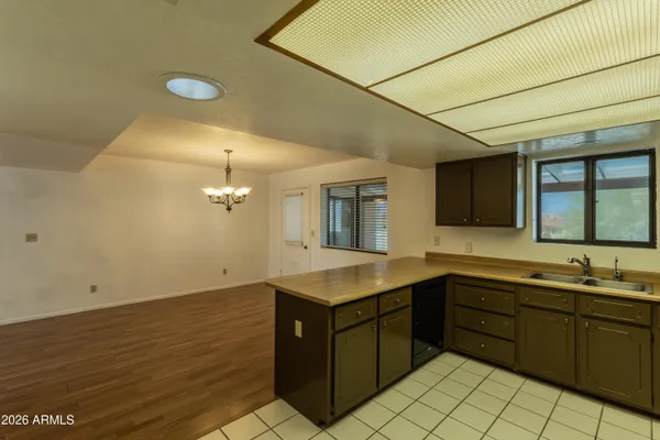 a kitchen with a sink and cabinets