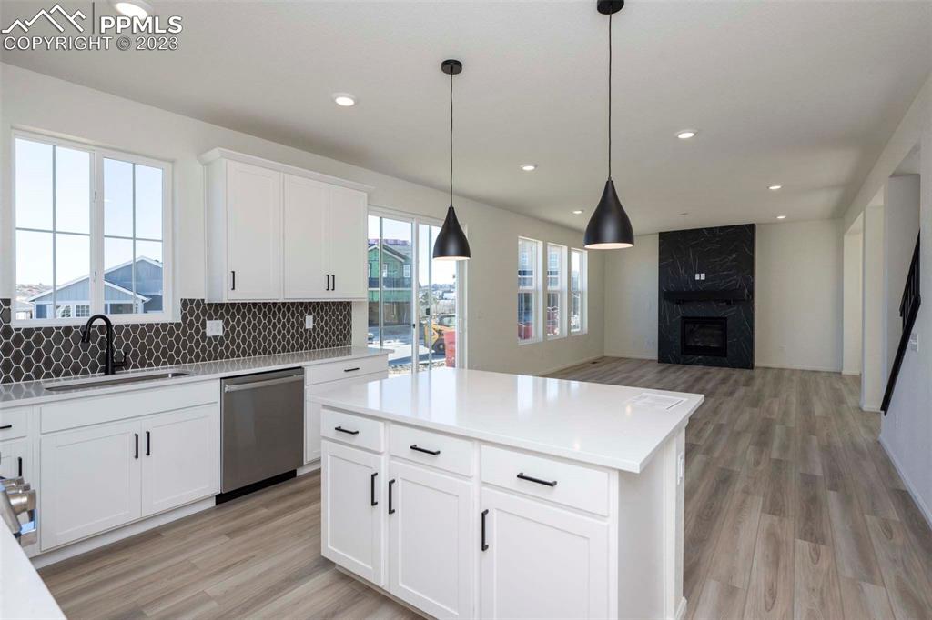 2039 Peachleaf Loop Castle Rock, CO 80108 - Photo 11 of 23 a kitchen with sink stove and cabinets