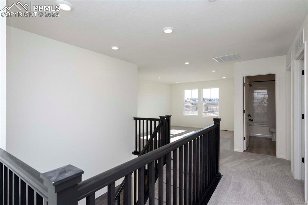 2039 Peachleaf Loop Castle Rock, CO 80108 - Photo 12 of 23 a view of hallway with stairs