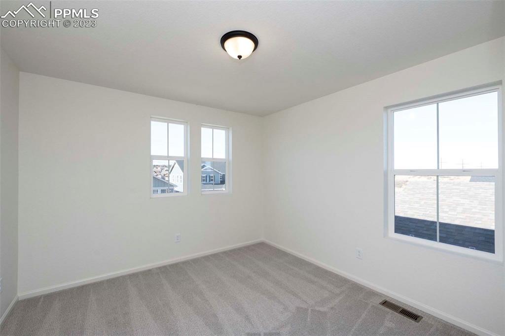 2039 Peachleaf Loop Castle Rock, CO 80108 - Photo 14 of 23 an empty room with a window