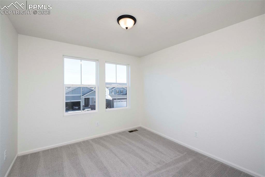 2039 Peachleaf Loop Castle Rock, CO 80108 - Photo 15 of 23 an empty room with windows