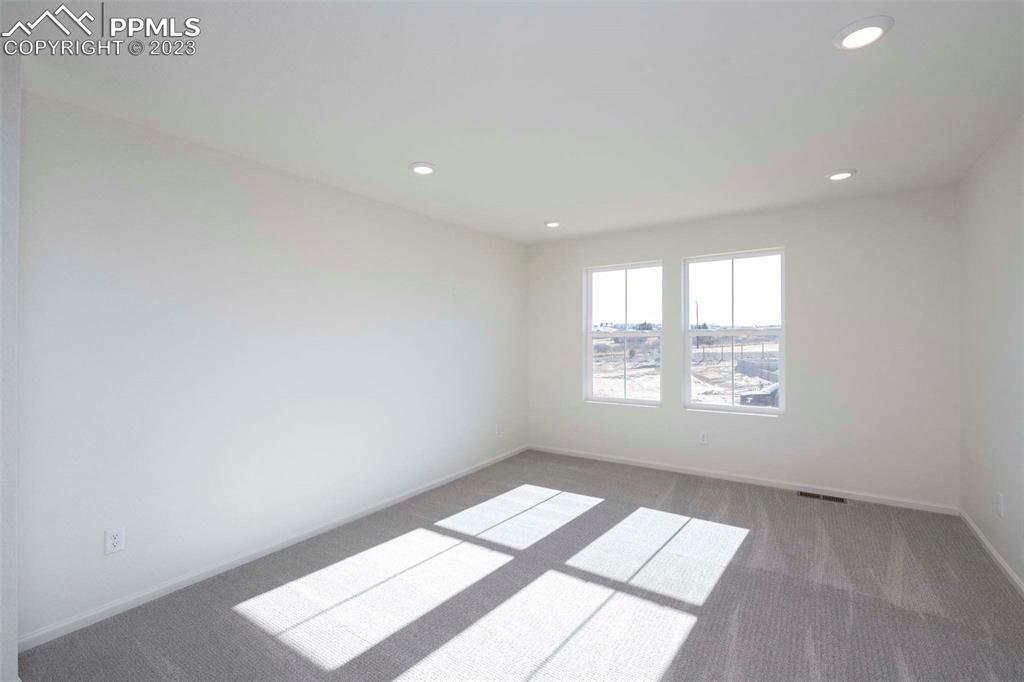 2039 Peachleaf Loop Castle Rock, CO 80108 - Photo 17 of 23 a view of an empty room and a window