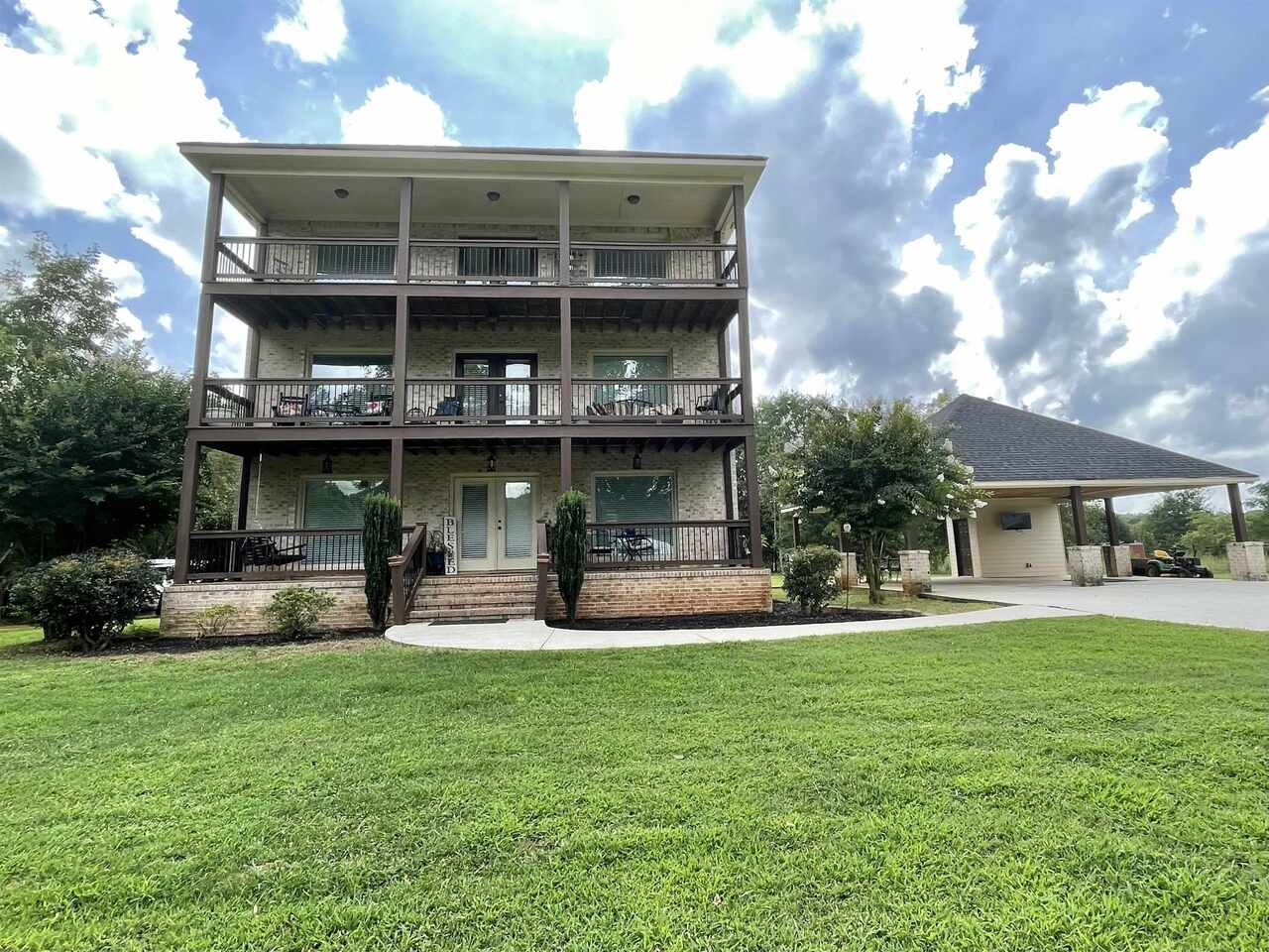 2949 Hester Town Road Monroe, GA 30655 - Photo 1 of 1 a view of a house with a yard porch and sitting area