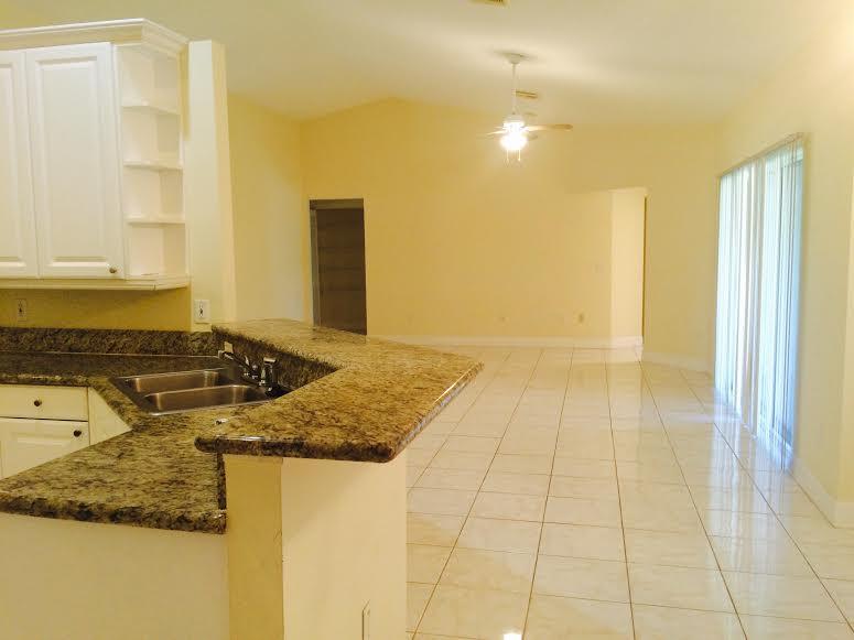 2354 Southwest Neal Road Port St. Lucie, FL 34953 - Photo 5 of 13 kitchen to lr