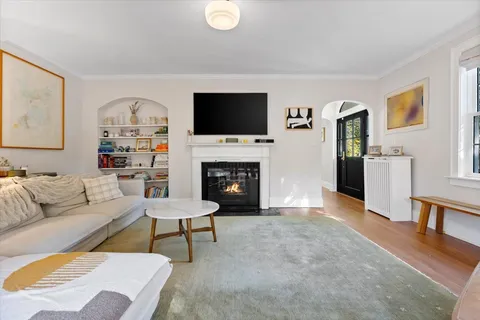 a view of a livingroom with furniture and wooden floor