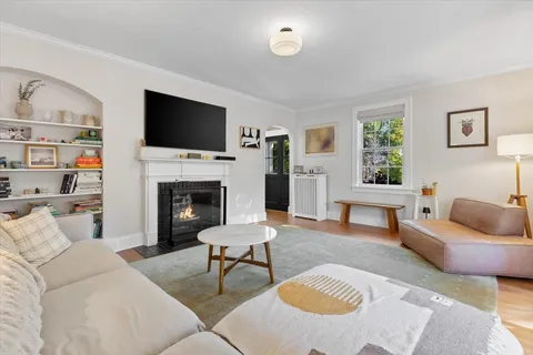 a bedroom with furniture and a wooden floor