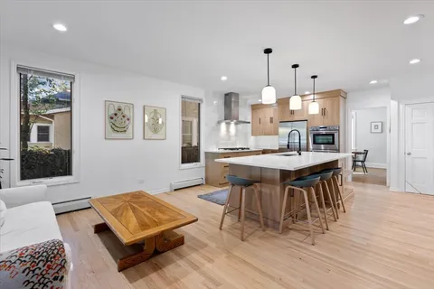 a view of a dining room with furniture and wooden floor