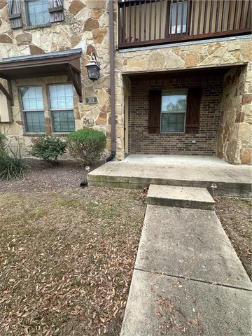 a stone house with a outdoor space