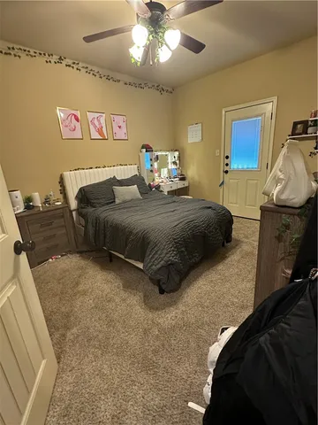 a bedroom with a bed and window