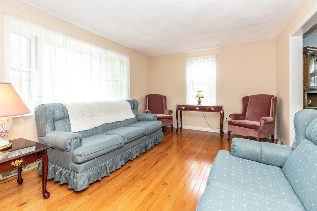 8 Comanche Circle Billerica, MA 01821 - Photo 12 of 35 a living room with furniture and a large window