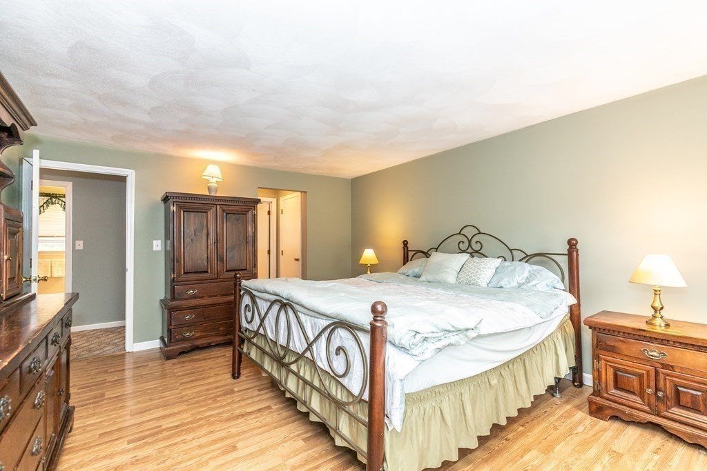 8 Comanche Circle Billerica, MA 01821 - Photo 16 of 35 a bedroom with a bed and a view of bedroom