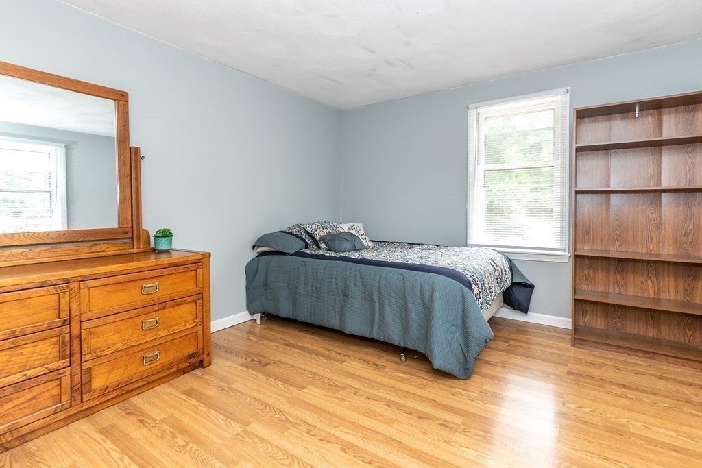 8 Comanche Circle Billerica, MA 01821 - Photo 22 of 35 a bedroom with a bed and a cabinets