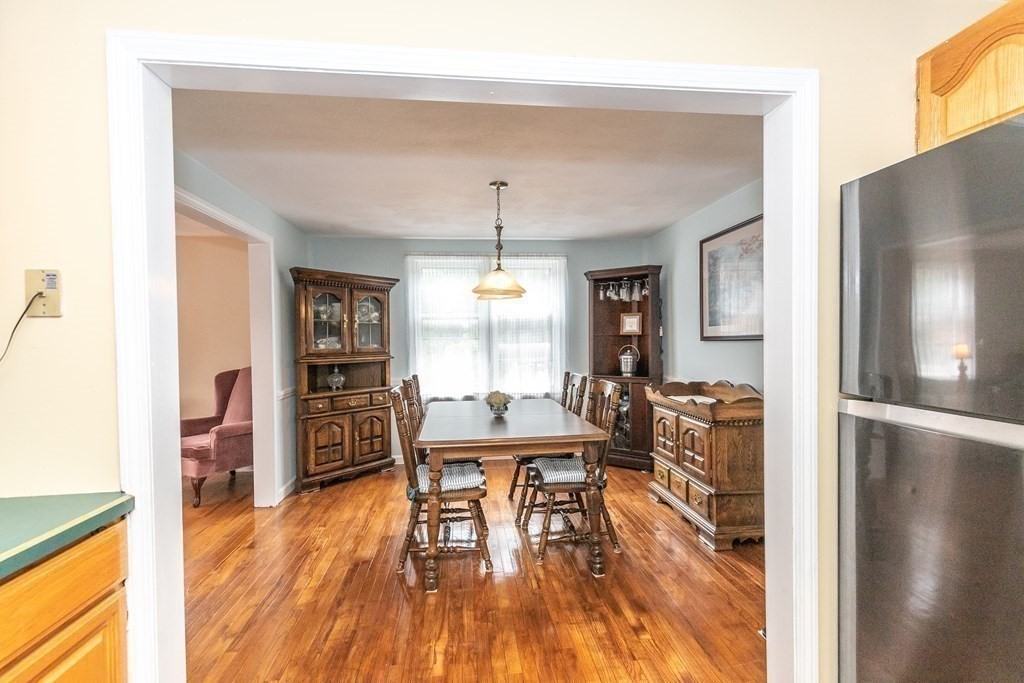 8 Comanche Circle Billerica, MA 01821 - Photo 7 of 35 a dining room with furniture and wooden floor