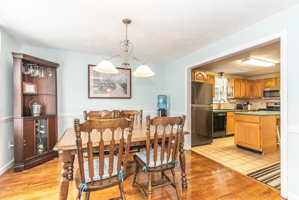 8 Comanche Circle Billerica, MA 01821 - Photo 8 of 35 a view of a dining room with furniture and chandelier