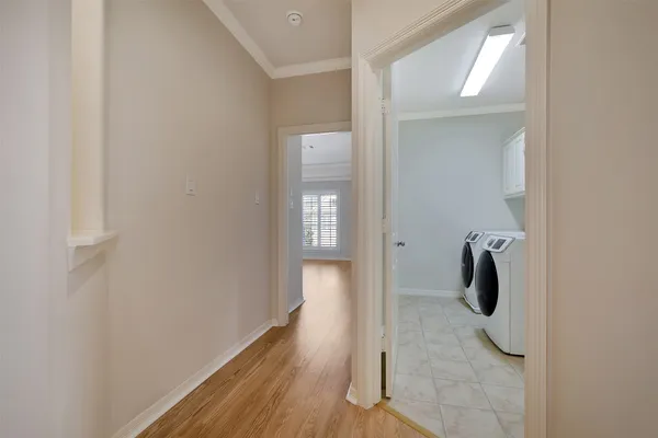 an entryway in a room with wooden floor