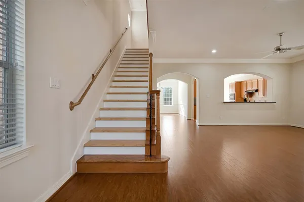 a view of an entryway with wooden floor