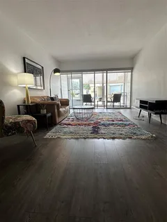 a living room with furniture window and a table