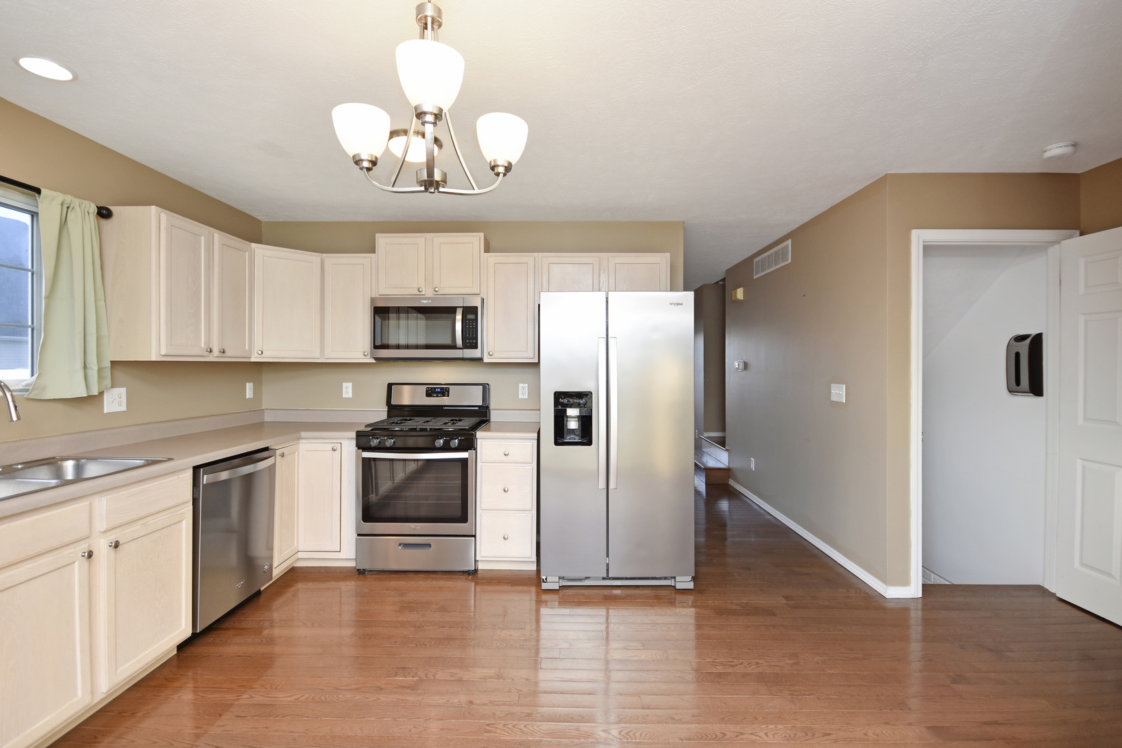 5 Andy Court, Unit 4 Bloomington, IL 61704 - Photo 11 of 52 a kitchen with granite countertop a stove and a sink