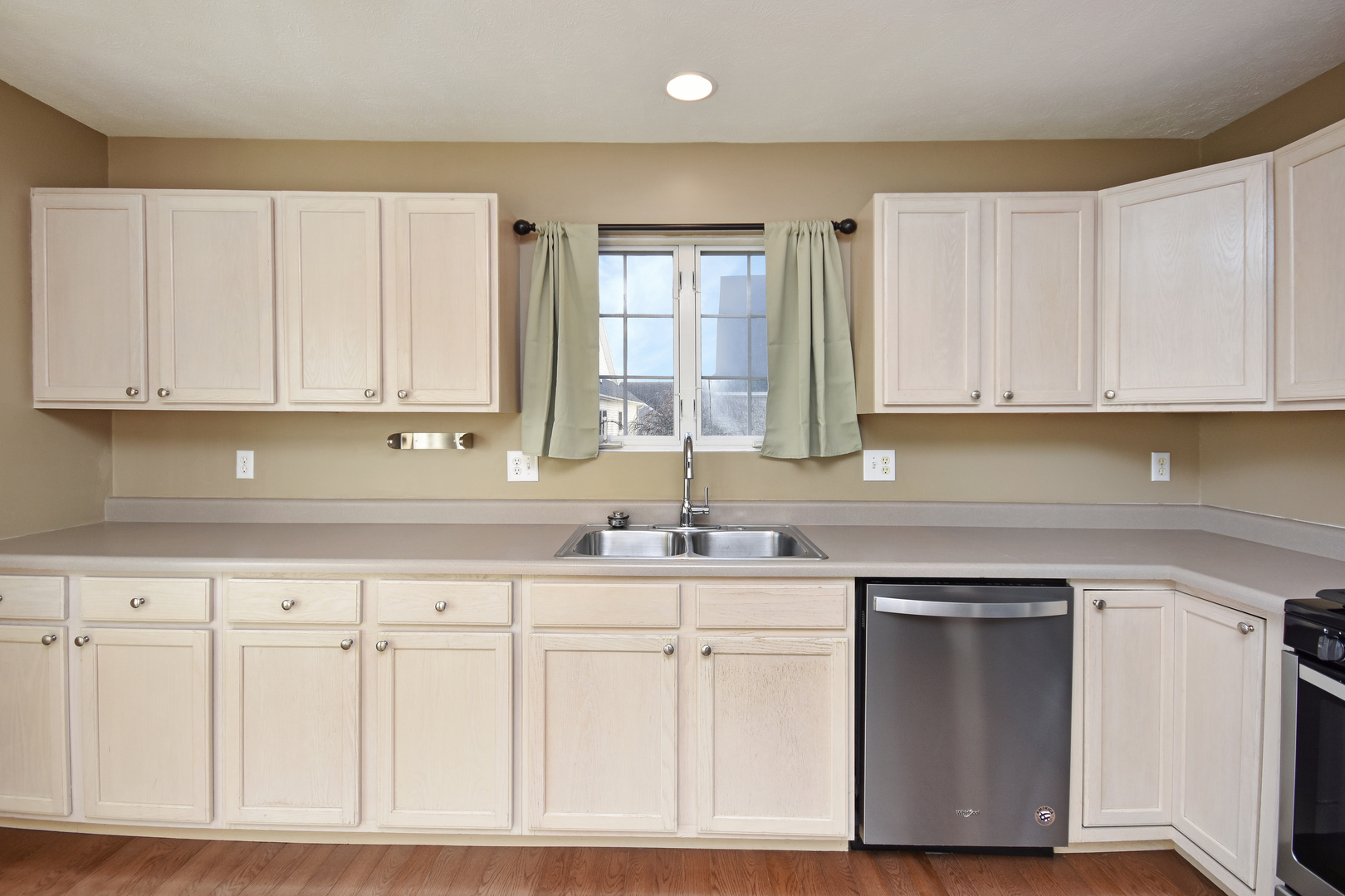 5 Andy Court, Unit 4 Bloomington, IL 61704 - Photo 17 of 52 a kitchen with white cabinets and sink