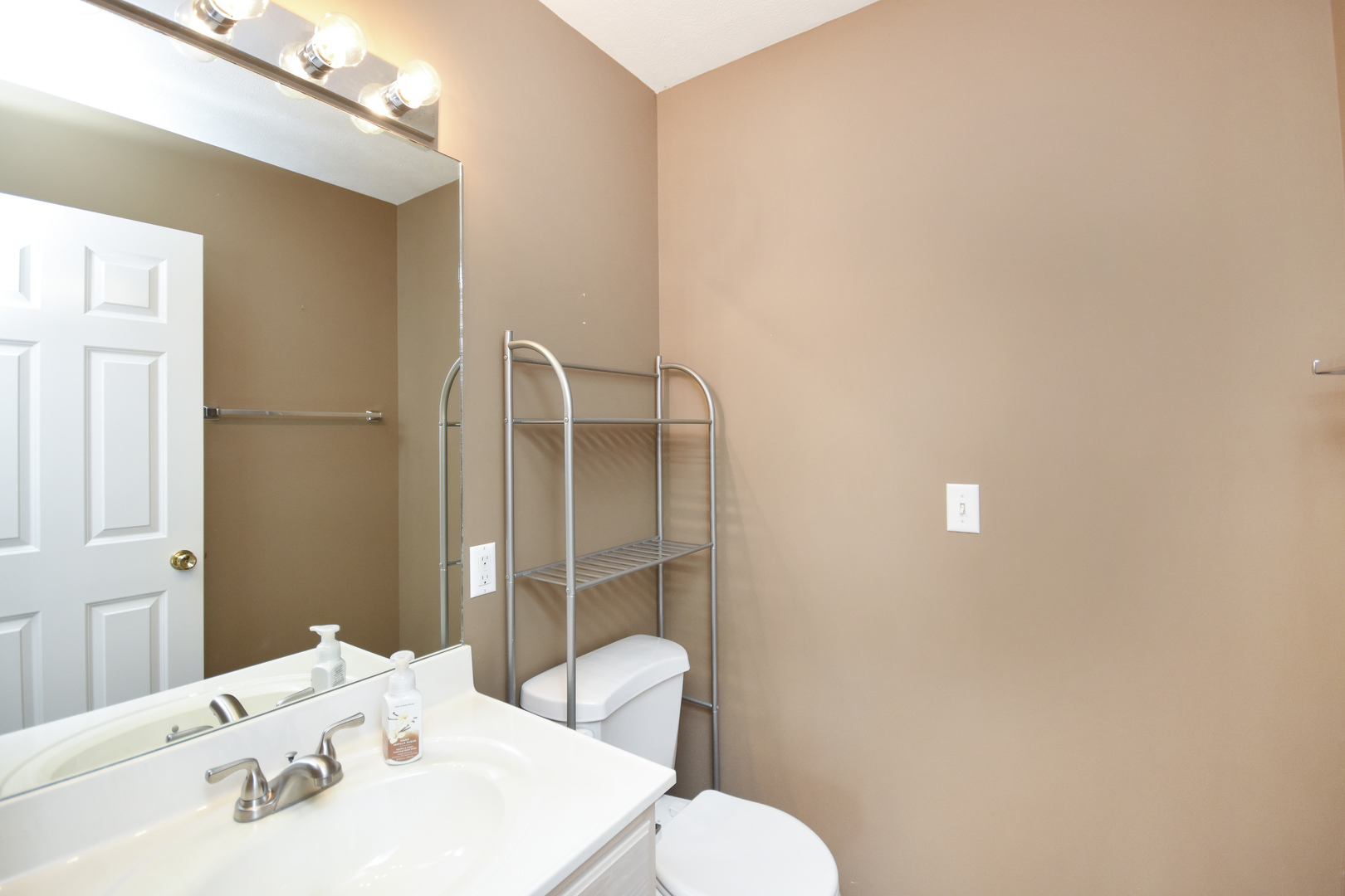 5 Andy Court, Unit 4 Bloomington, IL 61704 - Photo 20 of 52 a bathroom with a sink and a toilet