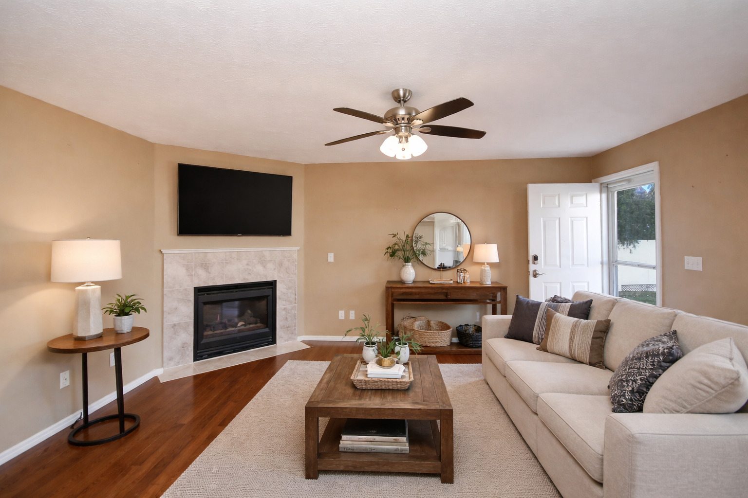 5 Andy Court, Unit 4 Bloomington, IL 61704 - Photo 3 of 52 a living room with furniture a fireplace and a flat screen tv